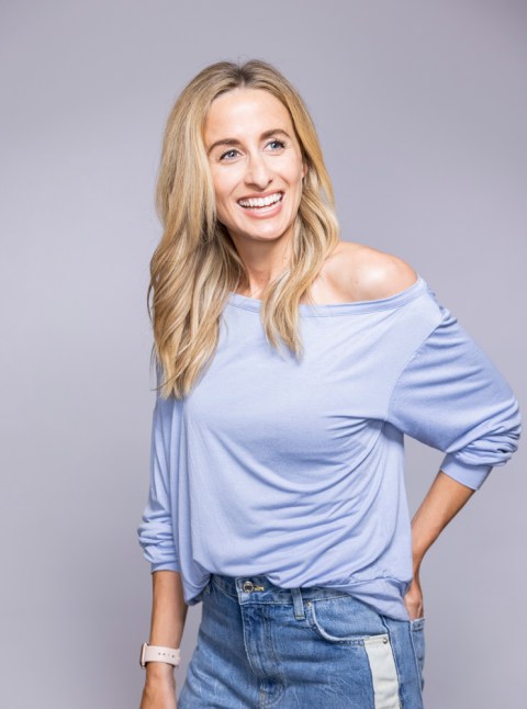 dr julie smith wearing blue top on grey background